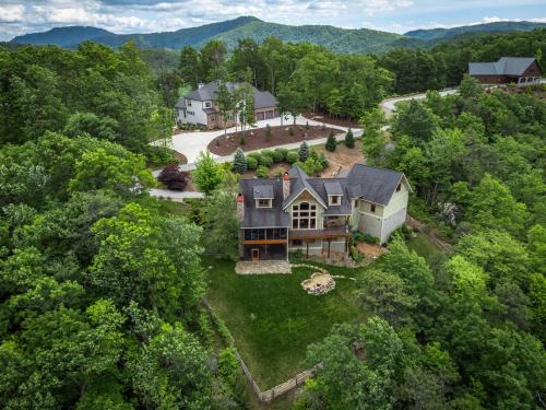 an aerial view of a house in the woods at Frolly Falls in Black Mountain