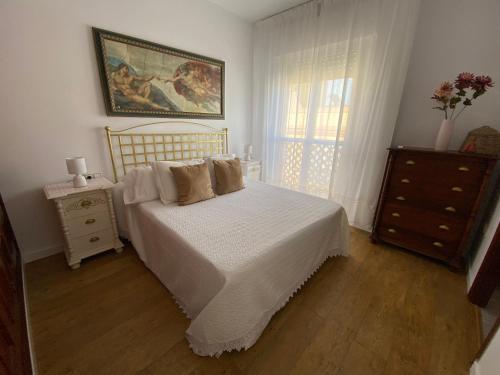 Ένα ή περισσότερα κρεβάτια σε δωμάτιο στο Apartamento La Isla