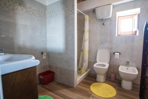 a bathroom with a toilet and a sink at Home at Calascio in Calascio