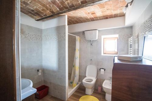 a bathroom with a toilet and a sink at Home at Calascio in Calascio