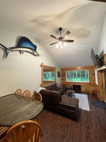 a living room with a couch and a table at The Clear Lake Retreat in Forest Lake