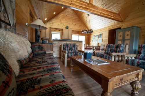 a living room with a couch and a table at Beyul Retreat in Meredith