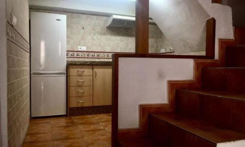 A kitchen or kitchenette at LA CASITA DE LAS HADAS