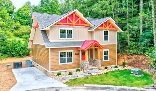 a small house with a red roof at A Breath of Fresh Air in Gatlinburg