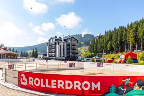 a skate park with a building in the background at Shelter Apart Hotel in Bukovel
