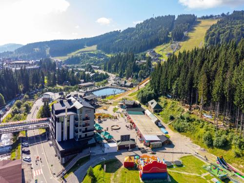 an aerial view of a water park with a roller coaster at Shelter Apart Hotel in Bukovel