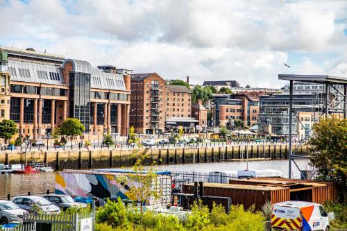 a city with buildings and a river with cars at Hotel Indigo Newcastle by IHG in Newcastle upon Tyne