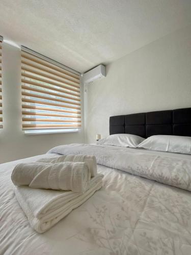 Ένα ή περισσότερα κρεβάτια σε δωμάτιο στο Apartment Diletta