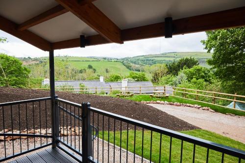 a view from the porch of a farm house at Wildwood Quarry Retreat in Mold