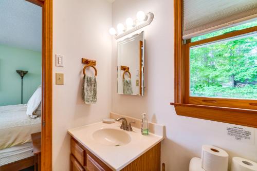 a bathroom with a sink and a window at Tallassee Family Home with Stunning Smoky Mtn Views in Tallassee
