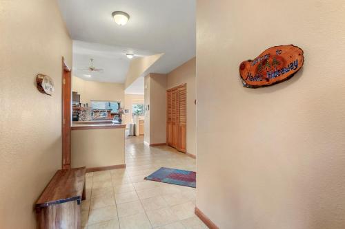 a hallway of a home with a room with a bench at Lookout Ridge 45 by Great Western Lodging in Dillon