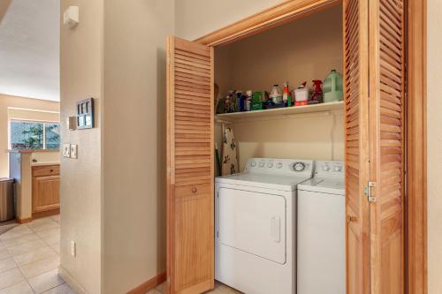 a laundry room with a washer and dryer at Lookout Ridge 45 by Great Western Lodging in Dillon
