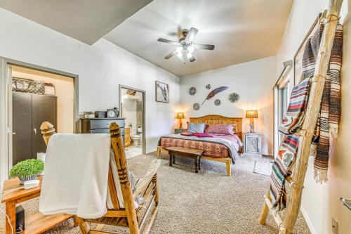 a bedroom with a bed and a ceiling fan at Ruidoso Cabin Rental with Hot Tub Near Midtown! in Ruidoso