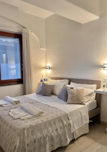 Postel nebo postele na pokoji v ubytování B&B Raggi d'Ischia