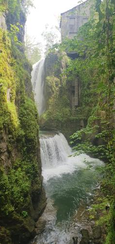a waterfall in the middle of a river at Gîte des trois rivières in Syam