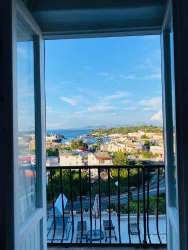 a balcony with a view of a city at Black Market Hotel in Ischia