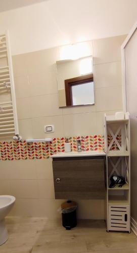a bathroom with a sink and a mirror at Tana Libera Tutti 3 Nature, Yourself, Love in Viggianello