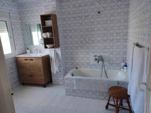 a bathroom with a bath tub and a sink at Ático en Estepona, Malaga in Estepona