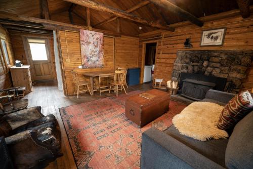 a living room with a couch and a fireplace at Beyul Retreat in Meredith