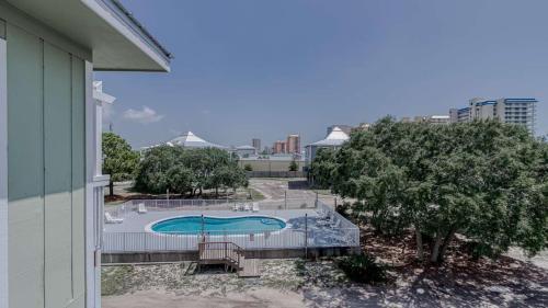 a view of a swimming pool from a building at Romar Village 322- short walk to beach pool in Orange Beach