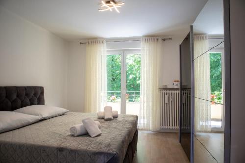 a bedroom with a bed with two towels on it at Mega Lux Apartment in Esslingen