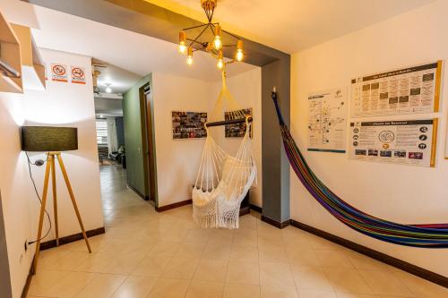 a hallway with a hammock hanging from a wall at Poblado Guest House in Medellín