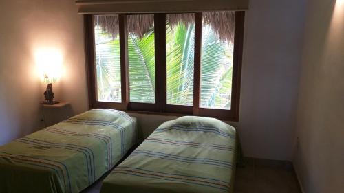 Кровать или кровати в номере Bungalows Lydia San Pancho