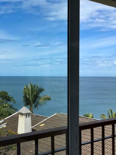 a view of the ocean from a balcony at Villa Dei Fiori in São Sebastião