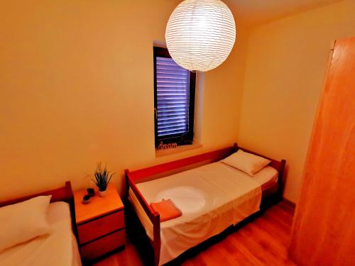 מיטה או מיטות בחדר ב-Haus Convallaria