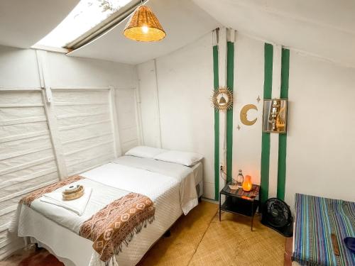 a bedroom with two beds in a room at Unicorn Reborn - Peaceful Rentals in San Marcos La Laguna