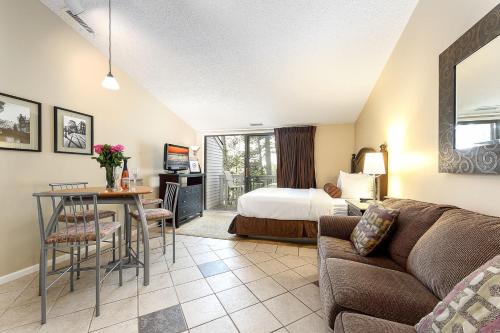 a living room with a bed and a couch at The Shores in Williamsburg