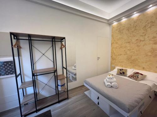 a bedroom with a bunk bed and a ladder at Monolocale Pura Vida in Viareggio