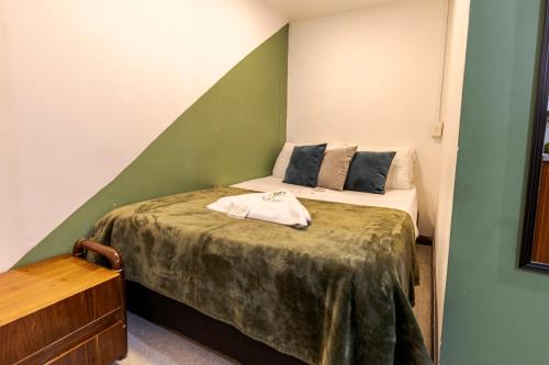Una cama o camas en una habitación de Poblado Guest House