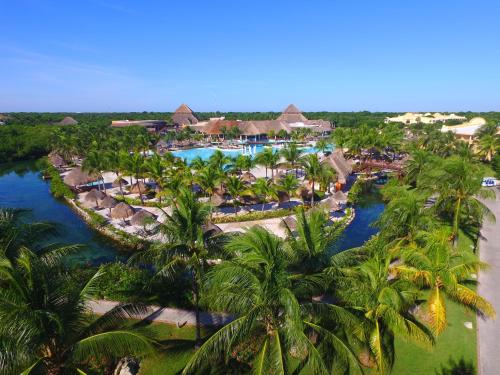 an aerial view of a resort with palm trees at Grand Palladium Colonial Resort & Spa - All Inclusive in Akumal