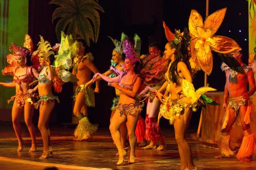 a group of dancers in costume on a stage at Grand Palladium Colonial Resort & Spa - All Inclusive in Akumal