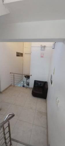 an empty room with a table and a chair in it at Hospedaje Moralillos in Yurimaguas