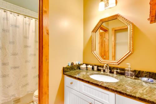 a bathroom with a sink and a mirror at Dog-Friendly Lavonia Home with Dock and Lake Access in Lavonia