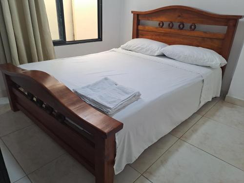 Una cama o camas en una habitación de Apto 1