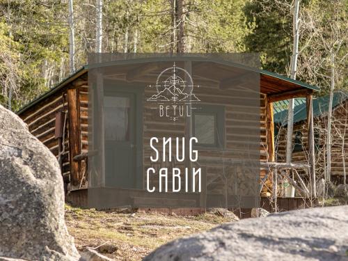 a sign on the side of a tiny cabin at Beyul Retreat in Meredith