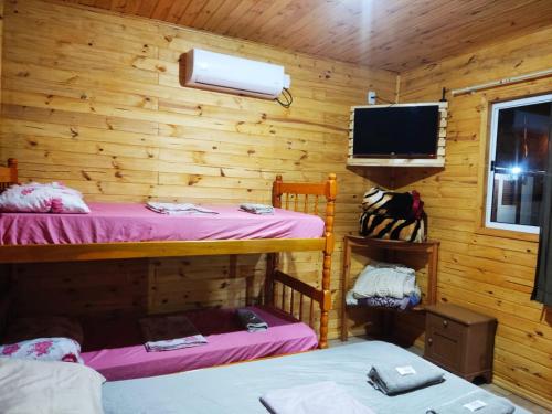 Ένα ή περισσότερα κρεβάτια σε δωμάτιο στο Hotel Alvorada