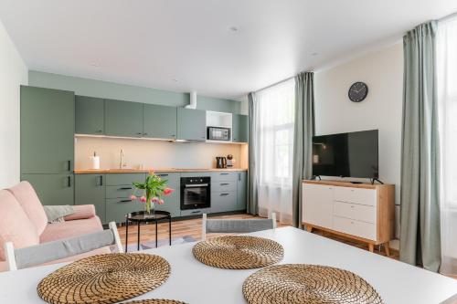 a living room with a couch and a table at Liidia Apartments in Haapsalu