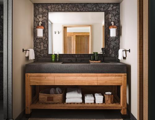 a bathroom with a sink and a mirror at 1 Hotel Hanalei Bay in Princeville