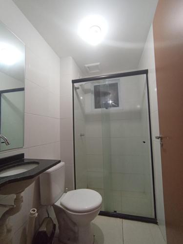 a bathroom with a shower and a toilet and a sink at Apartamento para São João in Campina Grande