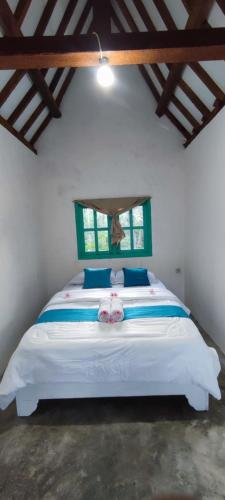 Postel nebo postele na pokoji v ubytování Hakiki Inn Bungalows