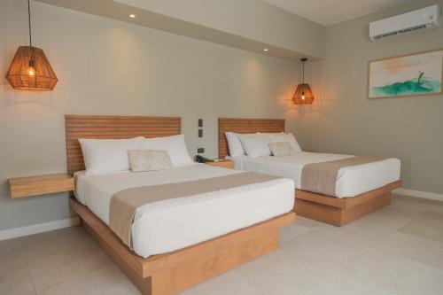 Katil atau katil-katil dalam bilik di Mirasurf Hotel & Waves