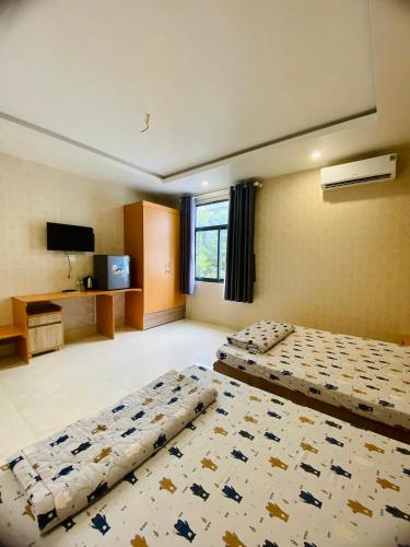 Ένα ή περισσότερα κρεβάτια σε δωμάτιο στο Sunny 1 Hometel Vinh Long