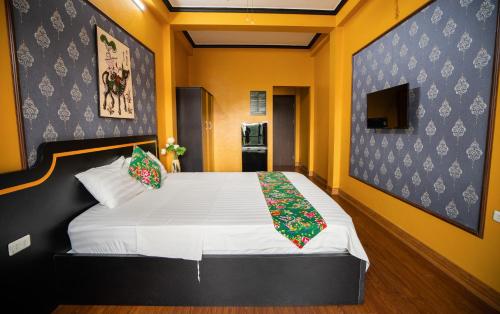 a bedroom with a large white bed in a room at VietHouse Homestay Ha Long in Ha Long