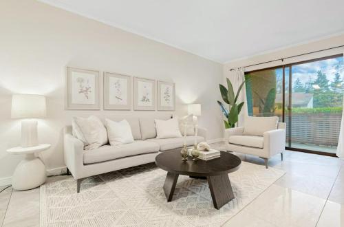a white living room with a couch and a table at Bellevue Modern Luxe Townhouse near DT 520 I405 in Bellevue
