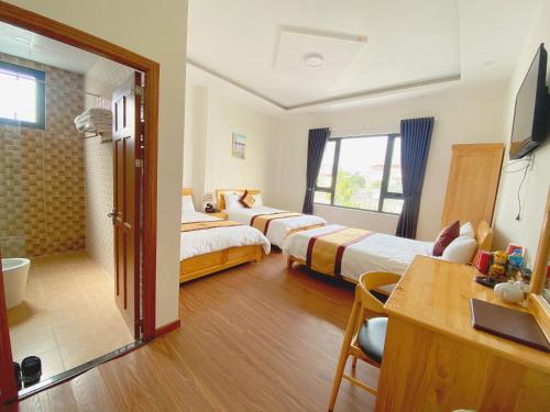 Postel nebo postele na pokoji v ubytování S79 Hoa Dang Hotel
