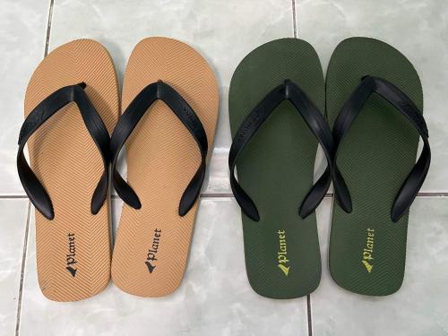 two pairs of shoes sitting next to each other at SSC Transient House & Staycation - Imus in Imus